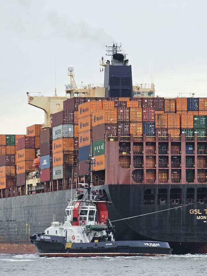 A large cargo ship loaded with colorful containers at Maasvlakte, Rotterdam.